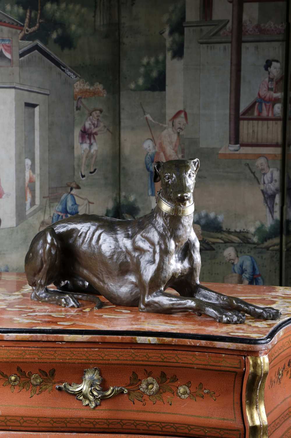 A LARGE FRENCH BRONZE MODEL OF A RECUMBENT GREYHOUND OR WHIPPET LATE 19TH / EARLY 20TH CENTURY