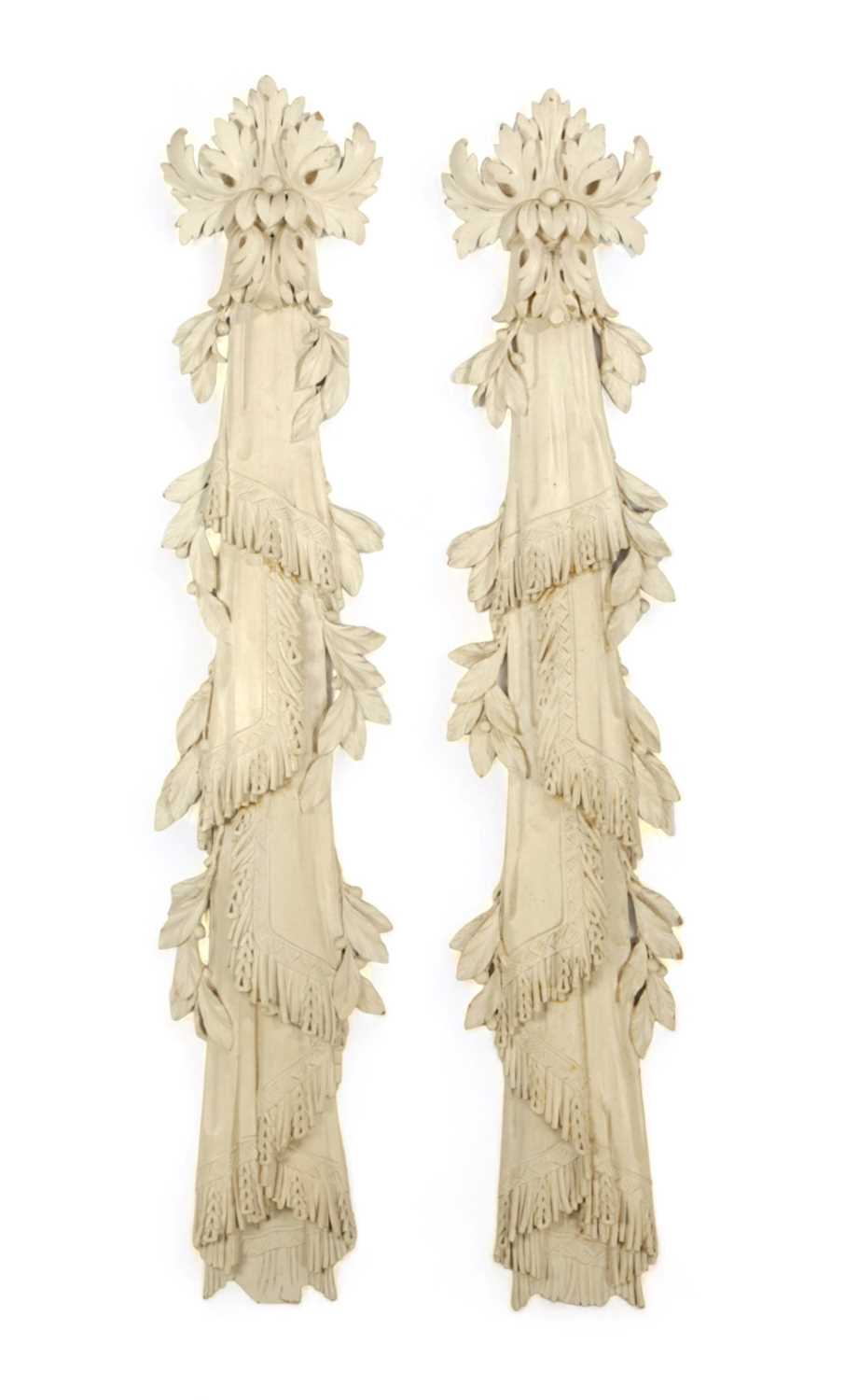 A PAIR OF CARVED AND PAINTED WOOD DRAPES IN GEORGE II STYLE, 20TH CENTURY each decorated with