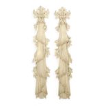 A PAIR OF CARVED AND PAINTED WOOD DRAPES IN GEORGE II STYLE, 20TH CENTURY each decorated with