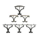 A SET OF FOUR EBONISED TREFOIL WALL BRACKETS BY COLEFAX & FOWLER, SECOND HALF 20TH CENTURY each with