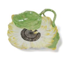 A CHELSEA PORCELAIN SUNFLOWER DISH OR STAND C.1755 modelled as a large open flower with two leaves