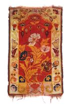 AN UNUSUAL ANATOLIAN PRAYER RUG EARLY 20TH CENTURY the blood red field with a large semi