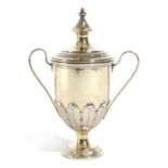 A SMALL SILVER-GILT CUP AND COVER BY D AND J WELLBY, LONDON, 1934 of vase form, with scroll