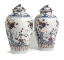 A PAIR OF DELFT POTTERY DORÉ VASES AND COVERS 18TH CENTURY painted in Imari style in blue, red and