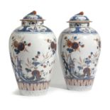 A PAIR OF DELFT POTTERY DORÉ VASES AND COVERS 18TH CENTURY painted in Imari style in blue, red and