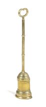 A BRASS DOORSTOP 19TH CENTURY of bell shape with a knopped stem and a pierced handle 55.3cm high