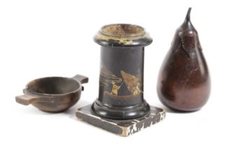A TREEN FRUITWOOD TEA CADDY IN THE FORM OF AN AUBERGINE 20TH CENTURY with a screw-off calyx and