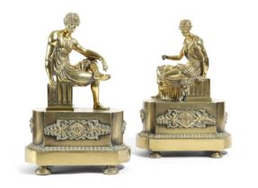 A PAIR OF FRENCH EMPIRE POLISHED BRONZE CHENETS ATTRIBUTED TO THOMIRE, EARLY 19TH CENTURY modelled