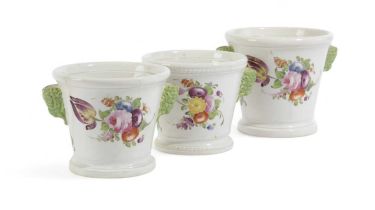 THREE PEARLWARE POTTERY CACHEPOTS OR JARDINIÈRES 19TH CENTURY painted with polychrome flower