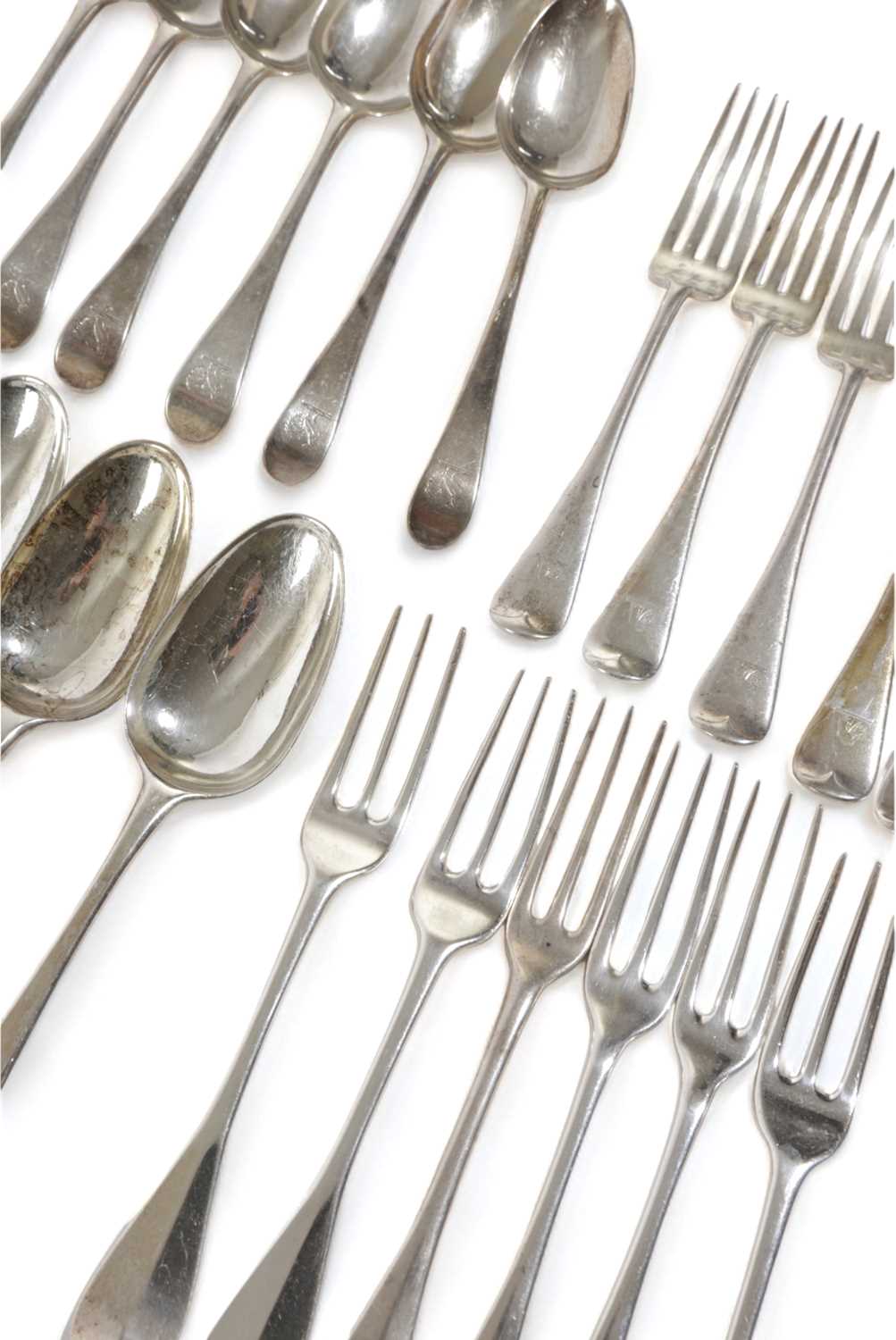 A COLLECTION OF SILVER FLATWARE comprising: six Scottish Hanoverian pattern three-pronged table