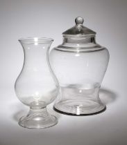 A GLASS STORAGE JAR AND COVER 19TH CENTURY of inverted baluster form, with a ball finial, together