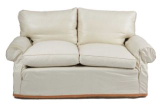 A MODERN TWO SEATER SOFA POSSIBLY BY PETER DUDGEON, 20TH CENTURY with a serpentine back, on