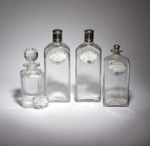 A PAIR OF GLASS AND SILVER PLATED DECANTERS AND COVERS 19TH CENTURY of shouldered rectangular