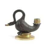 A REGENCY GILT AND PATINATED BRONZE SWAN CHAMBERSTICK EARLY 19TH CENTURY the nozzle decorated with