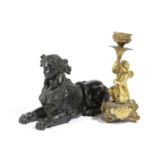 A FRENCH PATINATED METAL GRAND TOUR SPHINX MID-19TH CENTURY modelled recumbent, together with a gilt