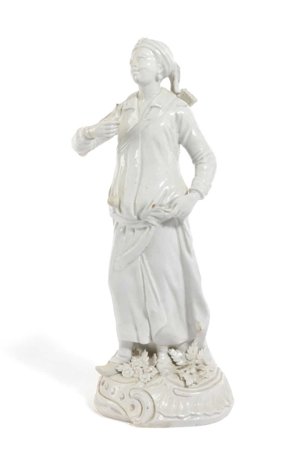 A WHITE-GLAZED DERBY PORCELAIN FIGURE OF THE ABYSSINIAN ARCHER C.1765 wearing a flowing robe with