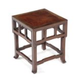 A CHINESE PADOUK STAND OR OCCASIONAL TABLE 19TH CENTURY of square section, the top inset with an