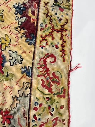 A EUROPEAN NEEDLEPOINT RUG C.1900 the pale wheat field with polychrome rondels enclosed by floral - Image 3 of 7
