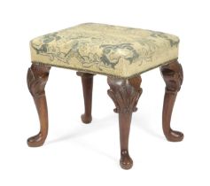 A SCOTTISH WALNUT STOOL IN GEORGE II STYLE, 19TH CENTURY the needlework seat above shell capped