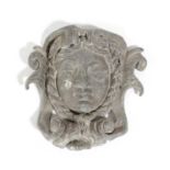 A GEORGE II LEAD MASK WALL PLAQUE MID-18TH CENTURY the female face framed by her plaited hair and