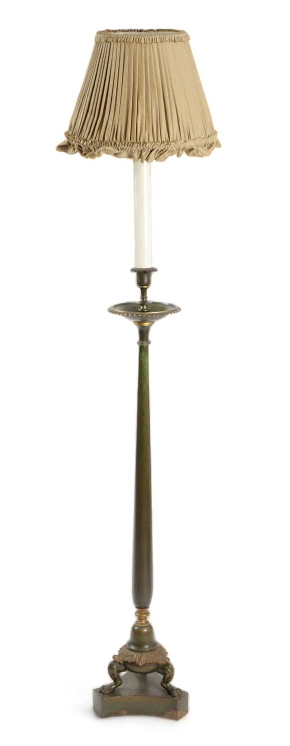 A PATINATED METAL STANDARD LAMP IN REGENCY STYLE, 19TH CENTURY converted from a candlestick with a