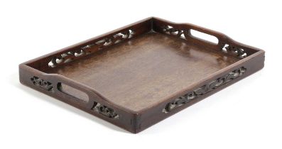 A CHINESE HARDWOOD TRAY 19TH CENTURY the gallery with pierced foliate decoration 4.4cm high, 35cm
