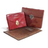 A RED LEATHER STATIONERY FOLDER EARLY 20TH CENTURY with tooled lattice decoration and a shield-