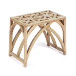 AN ARTS AND CRAFTS OAK STOOL EARLY 20TH CENTURY the interlaced top on arched Gothic supports 35.