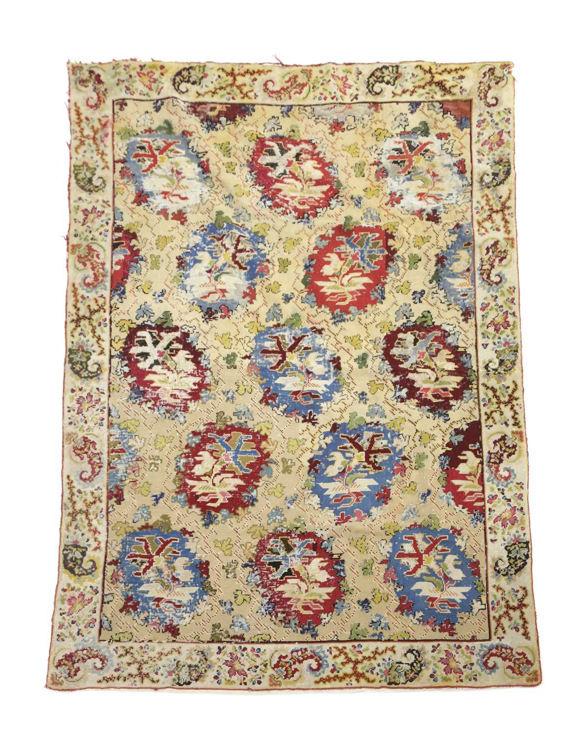 A EUROPEAN NEEDLEPOINT RUG C.1900 the pale wheat field with polychrome rondels enclosed by floral - Image 2 of 7