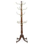 A REGENCY MAHOGANY AND BRASS COAT AND HAT STAND EARLY 19TH CENTURY the baluster turned stem