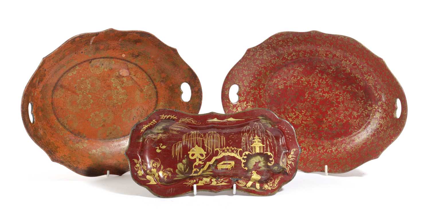 TWO PAPIER-MÂCHÉ TRAYS IN REGENCY STYLE, LATE 19TH / EARLY 20TH CENTURY of shaped oval form with