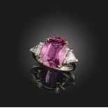A pink spinel and diamond ring, the cushion-shaped spinel weighing approximately 6.50 carats,