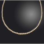 A natural pearl necklace, designed as a single strand of graduated pearls measuring approximately