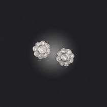 A pair of diamond cluster earrings, set with graduated circular-cut diamonds in platinum and gold,