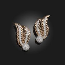 A pair of Retro diamond ear clips, mid 20th century, each of stylised foliate design, set with