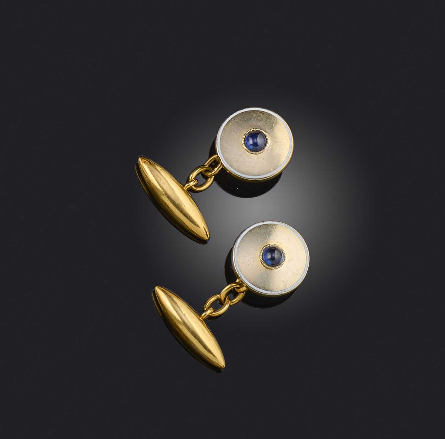 A pair of sapphire and enamel cufflinks, early 20th century, composite, the fronts of circular