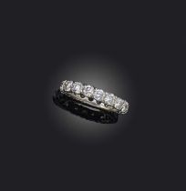 A diamond eternity ring, designed as a continuous band of claw-set brilliant-cut diamonds
