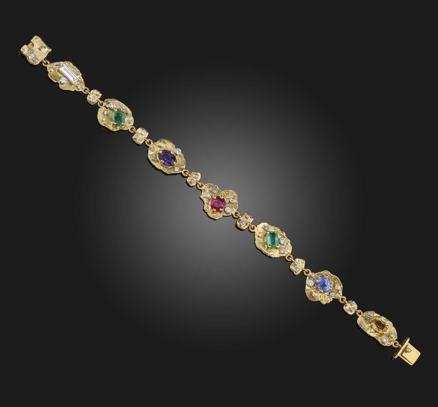 A multi-gem and diamond acrostic bracelet, 1970s, designed as a series of textured abstract gold
