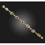 A multi-gem and diamond acrostic bracelet, 1970s, designed as a series of textured abstract gold