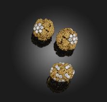 Boucheron, a gold and diamond demi-parure, 1970s, comprising: a pair of ear clips and a ring, each