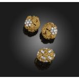 Boucheron, a gold and diamond demi-parure, 1970s, comprising: a pair of ear clips and a ring, each
