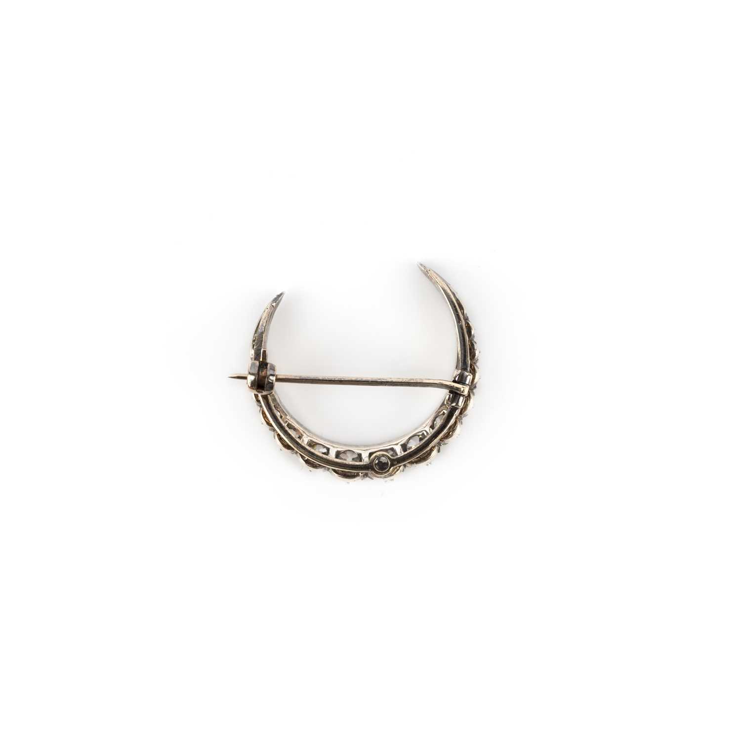 A Victorian diamond brooch, late 19th century, designed as a crescent moon, set with circular-cut - Image 2 of 2