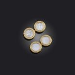 Cartier, a pair of mother of pearl and diamond cufflinks, each disc set with a central mother of