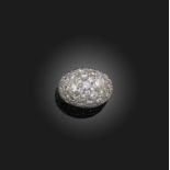 A diamond ring, of bombé design, pavé-set with brilliant-cut diamonds, mounted in white gold, size
