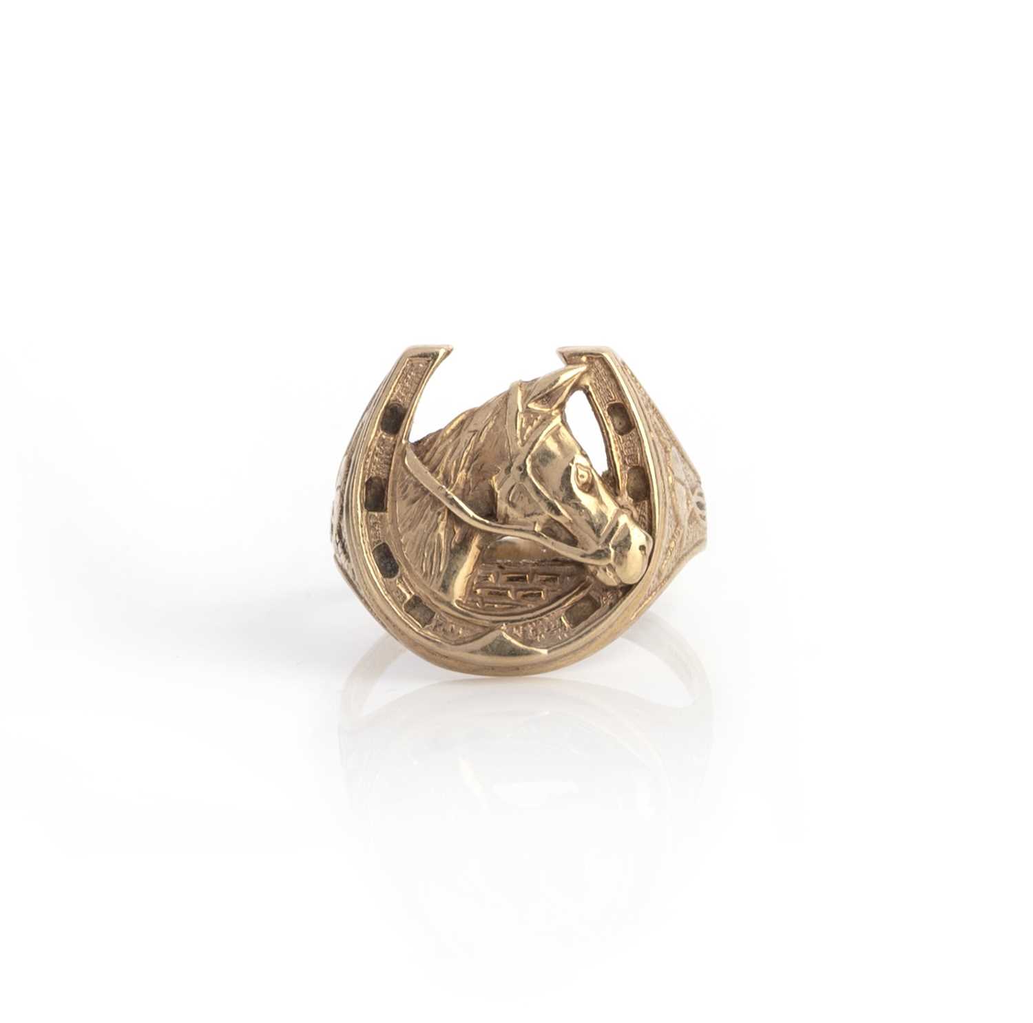 A gold ring, of horseshoe design, hallmarked for 9ct gold London 1994, sponsor I & BJ, size Z