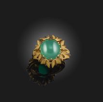 A green chalcedony ring, France, designed as a flower, the gold petals enclosing a cabochon green