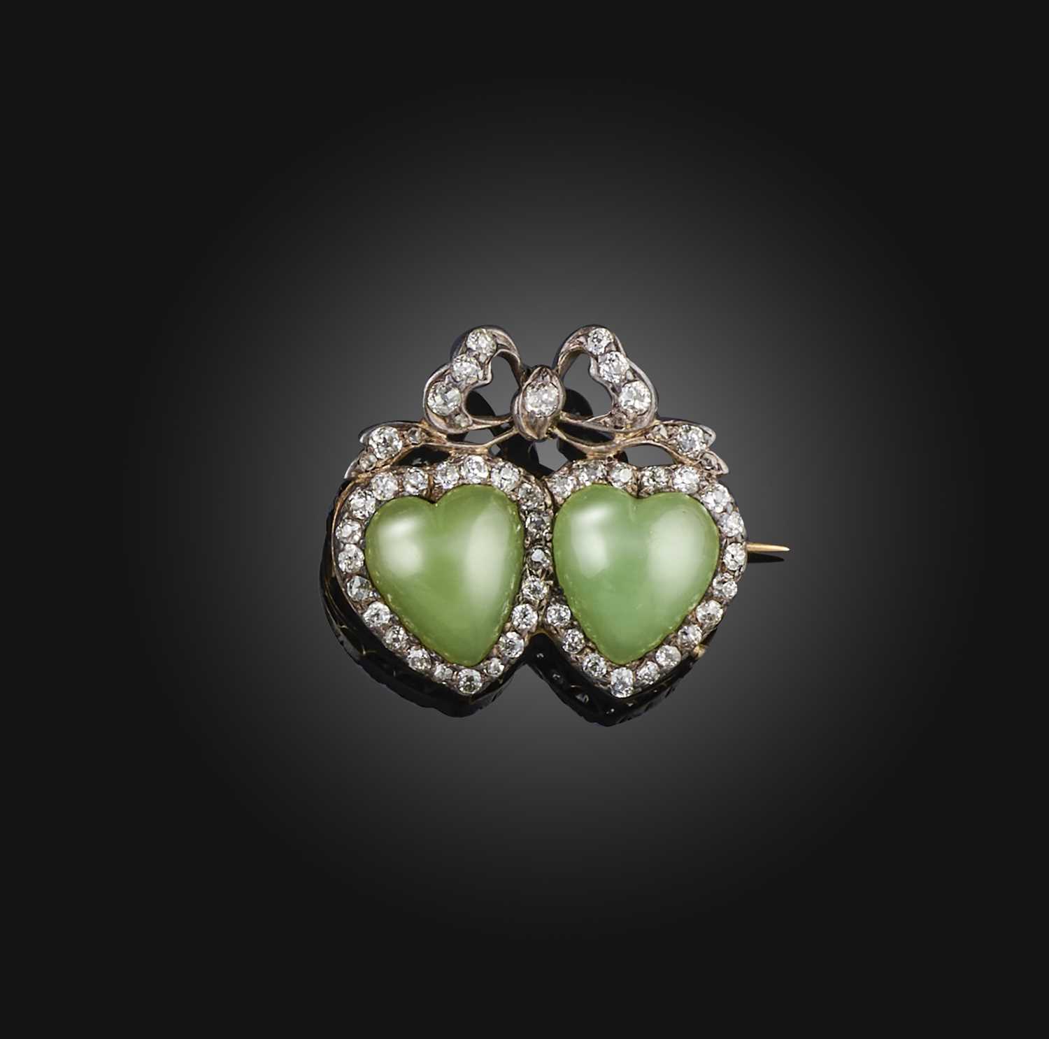 A Victorian chrysoprase and diamond brooch, late 19th century, designed as two hearts surmounted