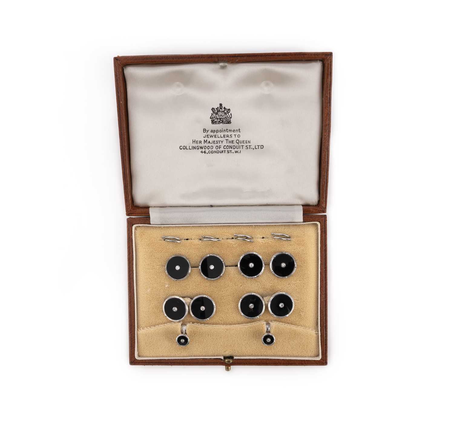 A cased dress set of cufflinks and six studs, each black onyx circular disc is centred with a - Image 2 of 2