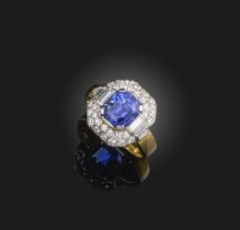 A sapphire and diamond ring, set with a step-cut sapphire measuring approximately 7.6 x 6.8 x 6.1mm,