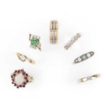 A group of seven gold and gem-set rings, comprising: an opal and ruby cluster ring, size I; a five